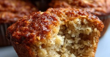 Deliciously baked banana oat muffins on a wooden table