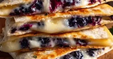 Blueberry breakfast quesadilla with fresh blueberries and melted cheese