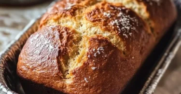 Freshly baked homemade church loaves on a wooden table