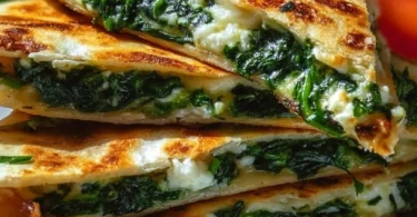 Spinach quesadillas with feta cheese, served with salsa and avocado.