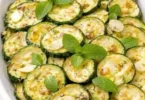Zucchini marinated in vinegar served in a fresh salad