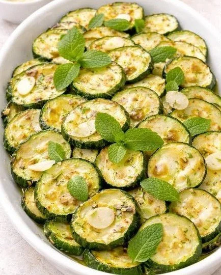 Zucchini marinated in vinegar served in a fresh salad