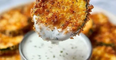 Plate of crispy air fryer zucchini chips seasoned and ready to eat