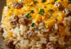 Cheesy hamburger rice casserole served in a baking dish