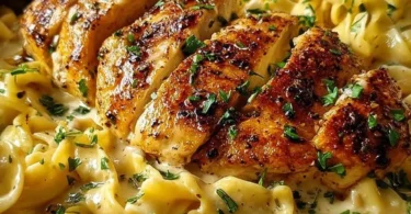 Plate of Chicken with Buttered Noodles garnished with parsley