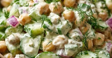 Chickpea and cucumber salad with creamy yogurt dressing served in a bowl