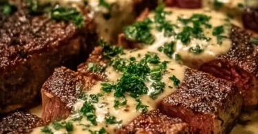 Creamy garlic sauce drizzled over a perfectly cooked steak
