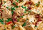 Crock Pot Creamy Cajun Chicken Pasta dish with vibrant colors and creamy texture.