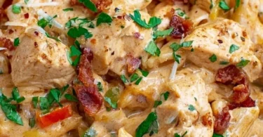 Crock Pot Creamy Cajun Chicken Pasta dish with vibrant colors and creamy texture.