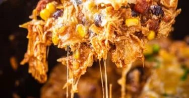 Crockpot Chicken Enchiladas Casserole served in a bowl with toppings