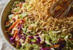 Crunchy ramen noodle salad with colorful vegetables and dressing