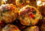 Plate of easy Thai baked chicken meatballs garnished with herbs