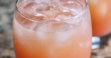 Refreshing iced guava white tea lemonade drink, perfect for summer.