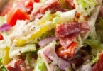 Delicious Italian Grinder Salad with fresh vegetables and dressing.