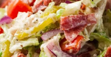 Delicious Italian Grinder Salad with fresh vegetables and dressing.