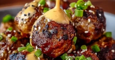 Plate of Korean BBQ meatballs served with spicy mayo dip
