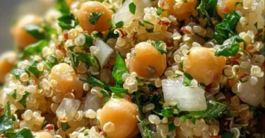 Lemon Herb Quinoa with Chickpeas served in a bowl garnished with fresh herbs.