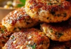 Mediterranean Chicken Patties garnished with fresh herbs and served on a plate