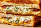 Melted roasted jalapeno popper grilled cheese sandwich with golden crust