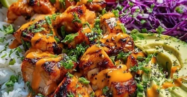 Spicy Maple Chicken served with coconut rice, garnished with herbs